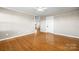 Open living room with hardwood floors and access to other rooms at 3603 Goodson Rd, Maiden, NC 28650