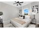 Modern bedroom with stylish decor, ceiling fan, and large window with natural light at 520 Waco Rd, Kings Mountain, NC 28086