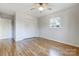 Spacious bedroom featuring hardwood floors and double closets at 6101 Davidson Dr, Matthews, NC 28104