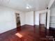 Spacious bedroom with hardwood floors and access to other rooms at 703 Buffalo St, Shelby, NC 28150