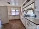 Kitchen with ample cabinetry and a double sink at 703 Buffalo St, Shelby, NC 28150