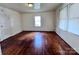 Living room with hardwood floors and large windows at 703 Buffalo St, Shelby, NC 28150