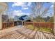 Spacious back deck overlooks fenced backyard with trampoline at 7750 Trailridge Dr, Tega Cay, SC 29708