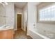 Double vanity bathroom with soaking tub and separate toilet area at 7750 Trailridge Dr, Tega Cay, SC 29708