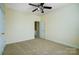 Spacious bedroom with carpet, neutral walls and ceiling fan at 7750 Trailridge Dr, Tega Cay, SC 29708