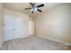 Spacious bedroom with double doors leading to an ensuite bathroom at 7750 Trailridge Dr, Tega Cay, SC 29708