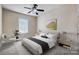 Bright bedroom with a comfortable bed and ample natural light at 7750 Trailridge Dr, Tega Cay, SC 29708