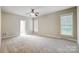 Bright bedroom featuring neutral walls and carpet at 7750 Trailridge Dr, Tega Cay, SC 29708