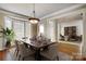 Formal dining room with hardwood floors and view of office at 7750 Trailridge Dr, Tega Cay, SC 29708