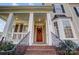 Two story home with a red door and brick steps leading to the porch at 7750 Trailridge Dr, Tega Cay, SC 29708