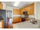Kitchen features stainless steel appliances and wood cabinets at 7750 Trailridge Dr, Tega Cay, SC 29708