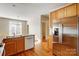 Kitchen boasts stainless steel appliances and wood cabinets at 7750 Trailridge Dr, Tega Cay, SC 29708