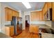 Bright kitchen with stainless steel appliances and wood cabinets at 7750 Trailridge Dr, Tega Cay, SC 29708