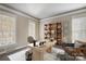 Home office with built-in shelving and natural light at 7750 Trailridge Dr, Tega Cay, SC 29708