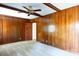 Spacious bedroom with wood paneling and ceiling fan at 829 Rawlinson Rd, Rock Hill, SC 29732