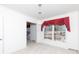Spacious dining room with large window and red drapes at 829 Rawlinson Rd, Rock Hill, SC 29732