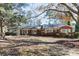 Brick ranch house with mature trees and a large yard at 829 Rawlinson Rd, Rock Hill, SC 29732