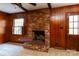 Gathering room with brick fireplace and wood paneling at 829 Rawlinson Rd, Rock Hill, SC 29732