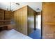 View of a hallway with wood paneling and doors at 829 Rawlinson Rd, Rock Hill, SC 29732