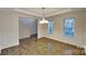 Bright dining room with hardwood floors and wainscoting at 133 Wellshire St, Mooresville, NC 28115