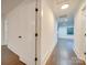 Bright hallway with white walls, hardwood floors, and recessed lighting at 1330 Mulberry Ave, Charlotte, NC 28216