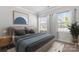 Bright bedroom with a queen bed, neutral decor, and ample natural light at 13725 Roderick Dr # 189, Huntersville, NC 28078