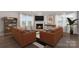 Spacious living room with fireplace, built-in shelving, and comfortable seating at 13725 Roderick Dr # 189, Huntersville, NC 28078