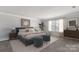 Main bedroom with plush bed, stylish decor, and a modern dresser at 13725 Roderick Dr # 189, Huntersville, NC 28078