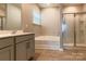 Main bathroom includes garden tub, double vanity, and shower at 138 Gray Willow St, Mooresville, NC 28117