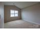 Bright bedroom featuring vaulted ceiling and carpet at 138 Gray Willow St, Mooresville, NC 28117