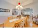 Formal dining room with large table and view to living room at 142 Forest Creek Dr, Statesville, NC 28625