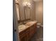 Double vanity bathroom with wood cabinets and tile floors at 158 White Rd, Wadesboro, NC 28170