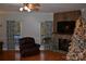 Living room featuring a fireplace, large TV, and comfortable seating at 158 White Rd, Wadesboro, NC 28170