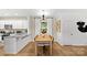 Kitchen and dining area with light wood table and chairs at 3301 Alcea St # 001, Charlotte, NC 28214