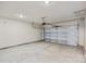 Attached two-car garage with white door and concrete floor at 4015 Bufflehead Dr, Charlotte, NC 28269