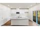 Kitchen island with granite counters and white cabinets at 4015 Bufflehead Dr, Charlotte, NC 28269