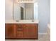 Double vanity bathroom with wood cabinets and a large mirror at 4275 Tucker Chase Dr, Midland, NC 28107