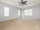 Spacious bedroom with neutral walls, carpet, and ceiling fan at 4275 Tucker Chase Dr, Midland, NC 28107