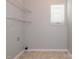 Laundry room with wire shelving and neutral walls at 4275 Tucker Chase Dr, Midland, NC 28107