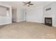 Spacious living room with a fireplace and neutral color scheme at 4275 Tucker Chase Dr, Midland, NC 28107