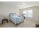 Bright bedroom with a full-size bed, treadmill, and window blinds at 5003 Elementary View Dr, Charlotte, NC 28269