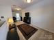 Spacious bonus room with a TV, rug, and shelving unit at 5003 Elementary View Dr, Charlotte, NC 28269