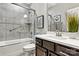 Bathroom with tiled shower and modern vanity at 5019 Pleasant Run Dr, Matthews, NC 28104