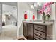 Clean bathroom with vanity, granite countertop, and view of bonus room at 5019 Pleasant Run Dr, Matthews, NC 28104