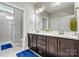 Double vanity bathroom with modern finishes at 5019 Pleasant Run Dr, Matthews, NC 28104