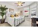 Main bedroom with dark wood frame bed and window seat at 5019 Pleasant Run Dr, Matthews, NC 28104