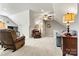 Bonus room featuring comfortable seating and ceiling fan at 5019 Pleasant Run Dr, Matthews, NC 28104