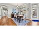 Bright dining area with hardwood floors and access to the backyard patio at 5019 Pleasant Run Dr, Matthews, NC 28104