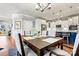 Elegant dining room with hardwood floors and a stylish chandelier at 5019 Pleasant Run Dr, Matthews, NC 28104