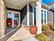 Front porch with stone and wood accents at 5019 Pleasant Run Dr, Matthews, NC 28104